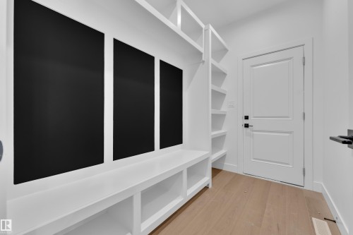 Mudroom with light wood-style floors - 202 Basin Court, Leduc, AB - Indoor