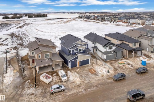 Snowy aerial view with a residential view - 202 Basin Court, Leduc, AB - Outdoor With View