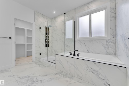 Full bath with a garden tub, a marble finish shower, and recessed lighting - 202 Basin Court, Leduc, AB - Indoor Photo Showing Bathroom