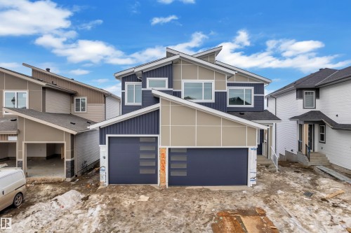 View of front facade with board and batten siding - 202 Basin Court, Leduc, AB - Outdoor