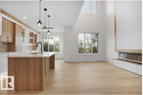 8447 Mayday Link, Edmonton, AB - Indoor Photo Showing Kitchen With Fireplace