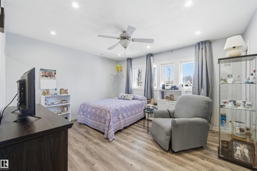 Bedroom with light wood-style flooring, ceiling fan, and recessed lighting - 848 Millbourne Road E, Edmonton, AB - Indoor Photo Showing Bedroom