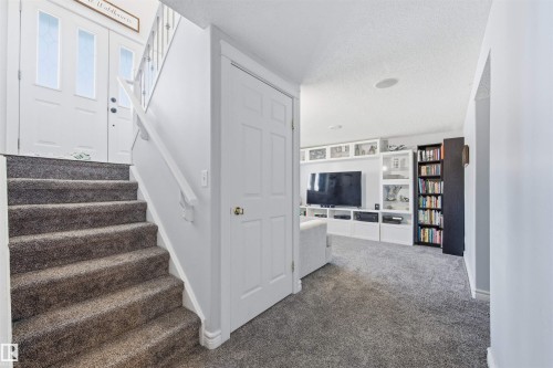 Stairway featuring carpet and a textured ceiling - 848 Millbourne Road E, Edmonton, AB - Indoor Photo Showing Other Room
