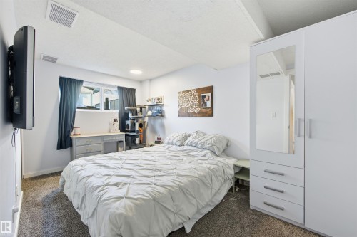 Bedroom with dark carpet - 848 Millbourne Road E, Edmonton, AB - Indoor Photo Showing Bedroom