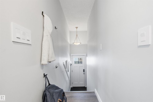 Entryway featuring wood finished floors and a textured ceiling - 848 Millbourne Road E, Edmonton, AB - Indoor Photo Showing Other Room