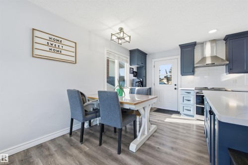 Dining area featuring light wood-style floors, recessed lighting, and wine cooler - 848 Millbourne Road E, Edmonton, AB - Indoor Photo Showing Dining Room
