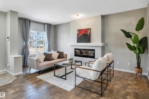 1271 Chappelle Boulevard, Edmonton, AB - Indoor Photo Showing Living Room With Fireplace