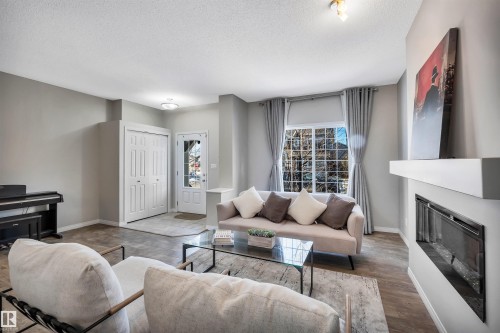 1271 Chappelle Boulevard, Edmonton, AB - Indoor Photo Showing Living Room With Fireplace