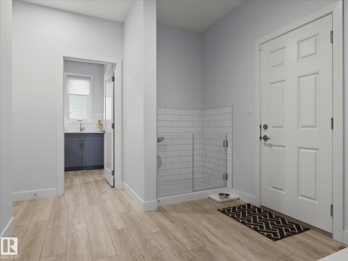 Dog Wash and large entry off of the triple garage. Includes bench and custom storage. - 1562 Howes Place, Edmonton, AB 