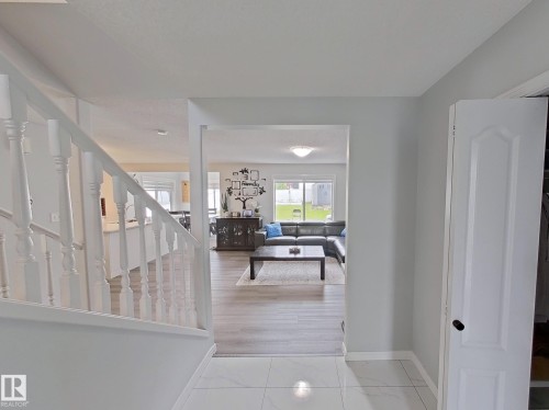Corridor featuring stairway and baseboards - 315 Wild Rose Way, Edmonton, AB - Indoor Photo Showing Other Room