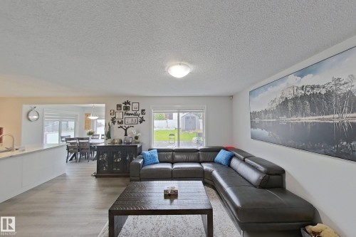 Living room featuring a textured ceiling and light wood-type flooring - 315 Wild Rose Way, Edmonton, AB - Indoor Photo Showing Living Room