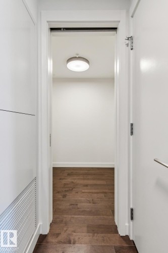 Hallway with dark wood-type flooring and baseboards - 3104 10360 102 Street, Edmonton, AB - Indoor Photo Showing Other Room