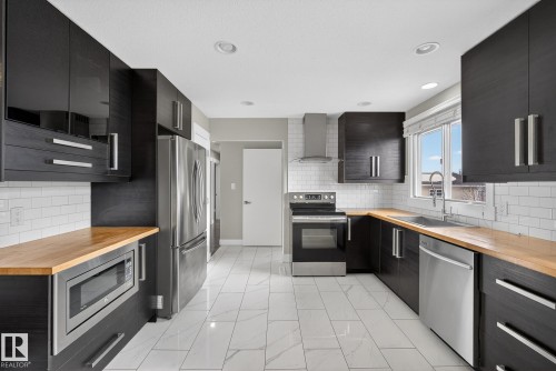 6219 150 Avenue, Edmonton, AB - Indoor Photo Showing Kitchen With Upgraded Kitchen