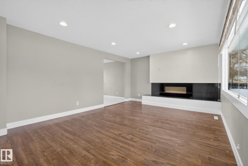 6219 150 Avenue, Edmonton, AB - Indoor Photo Showing Other Room With Fireplace