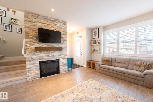 3112 Carpenter Landing Landing, Edmonton, AB - Indoor Photo Showing Living Room With Fireplace