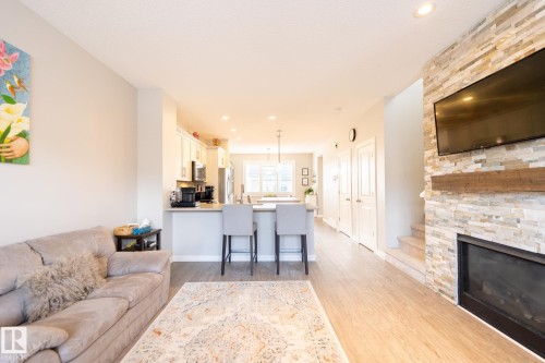 3112 Carpenter Landing Landing, Edmonton, AB - Indoor Photo Showing Living Room With Fireplace
