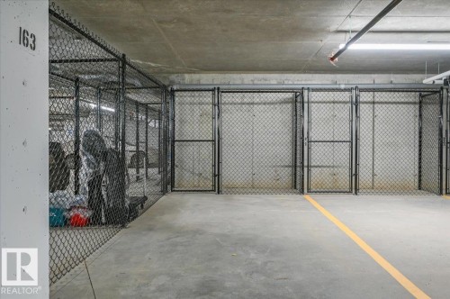 UNDER GROUND, HEATED, PARKING STALL WITH STORAGE CAGE - 322 7459 May Common Nw, Edmonton, AB - Indoor Photo Showing Garage