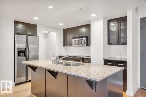 LARGE ISLAND, GREAT FOR ADDITIONAL PREP SPACE, AND ENTERTAINING - 503 10028 119 Street, Edmonton, AB - Indoor Photo Showing Kitchen With Double Sink With Upgraded Kitchen