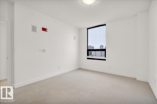 LARGE PRIMARY BEDROOM WITH BUILT IN SPEAKERS - 503 10028 119 Street, Edmonton, AB - Indoor Photo Showing Other Room