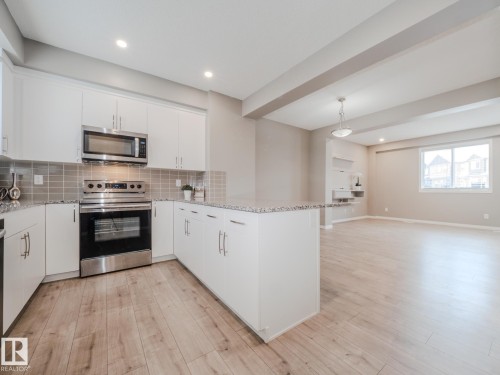 20 2072 Wonnacott Way, Edmonton, AB - Indoor Photo Showing Kitchen With Stainless Steel Kitchen With Upgraded Kitchen