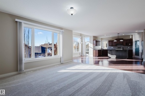 Unfurnished living room with dark carpet - 3612 Mclay Court, Edmonton, AB - Indoor