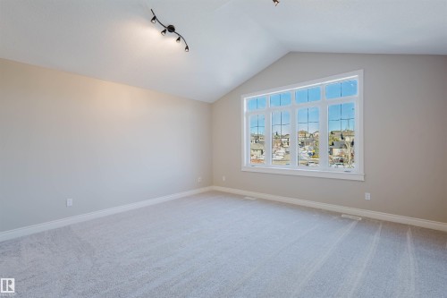 Unfurnished room with baseboards and light colored carpet - 3612 Mclay Court, Edmonton, AB - Indoor Photo Showing Other Room