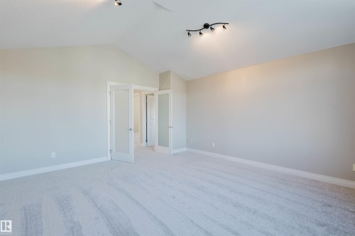 Unfurnished bedroom with light carpet and baseboards - 3612 Mclay Court, Edmonton, AB - Indoor Photo Showing Other Room