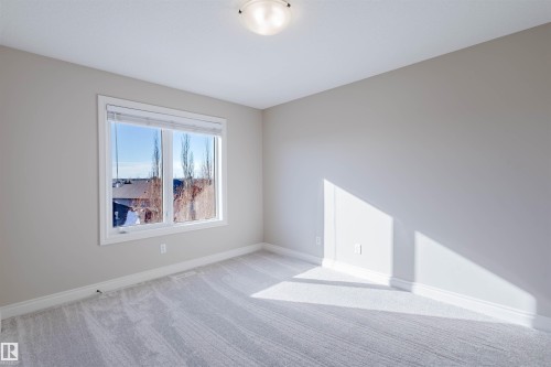 Unfurnished room with carpet floors and baseboards - 3612 Mclay Court, Edmonton, AB - Indoor Photo Showing Other Room