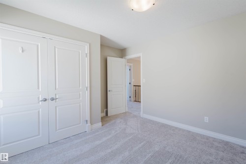 Unfurnished bedroom featuring a closet and carpet flooring - 3612 Mclay Court, Edmonton, AB - Indoor Photo Showing Other Room
