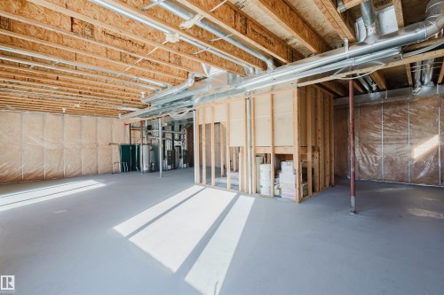 Unfinished below grade area featuring water heater - 3612 Mclay Court, Edmonton, AB - Indoor Photo Showing Basement