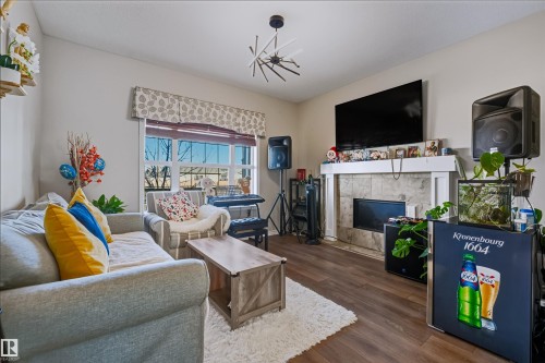 1214 Mcconachie Boulevard, Edmonton, AB - Indoor Photo Showing Living Room With Fireplace