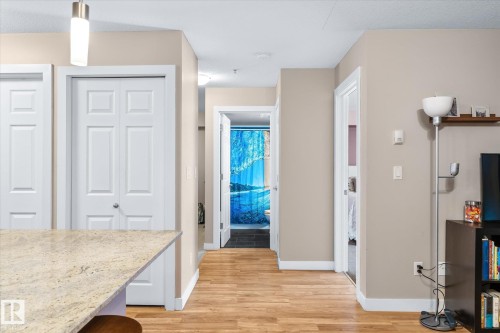 Hallway with light wood-style flooring and baseboards - 224 920 156 Street, Edmonton, AB - Indoor Photo Showing Other Room
