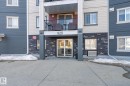 View of exterior entry featuring stone siding - 224 920 156 Street, Edmonton, AB  - Outdoor With Facade 