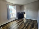 401 10710 116 Street, Edmonton, AB  - Indoor Photo Showing Living Room With Fireplace 