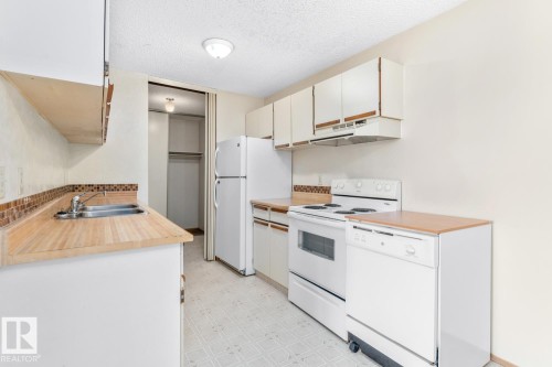 102 104 10 Street, Cold Lake, AB - Indoor Photo Showing Kitchen With Double Sink