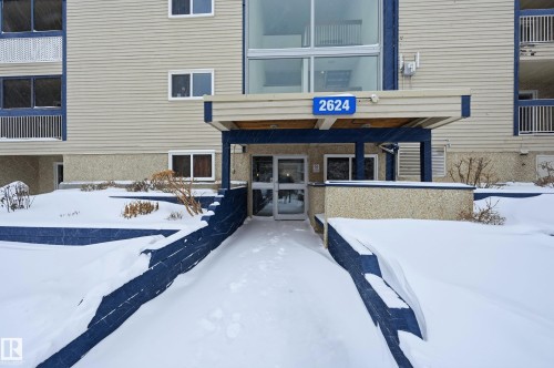 View of snow covered property entrance - 302 2624 Mill Woods Road E, Edmonton, AB - Outdoor