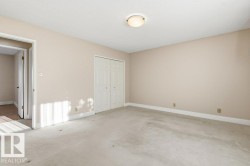 Unfurnished bedroom with carpet floors and a closet - 