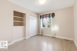 Unfurnished bedroom with light wood finished floors and a closet - 