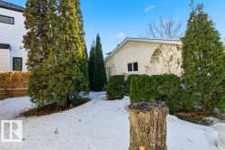 Snow covered property with stucco siding - 