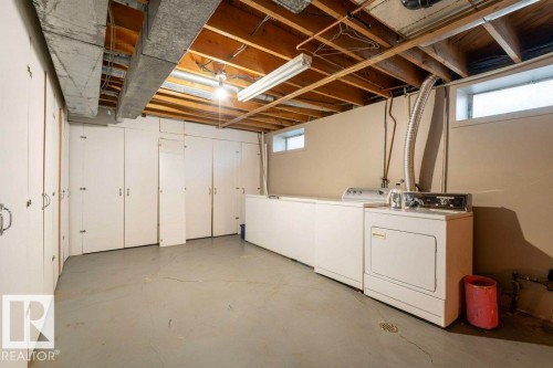 Below grade area featuring washer and dryer - 14335 47 Avenue, Edmonton, AB - Indoor Photo Showing Laundry Room