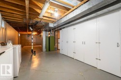 Unfinished basement featuring independent washer and dryer - 