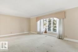 Spare room with carpet flooring and ornamental molding - 