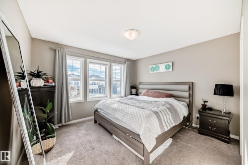 Primary bedroom featuring a walk in closet and 3 PC ensuite bathroom. - 8162 Chappelle Way, Edmonton, AB - Indoor Photo Showing Bedroom