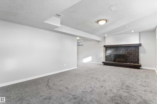 7204 10 Avenue, Edmonton, AB - Indoor Photo Showing Living Room With Fireplace