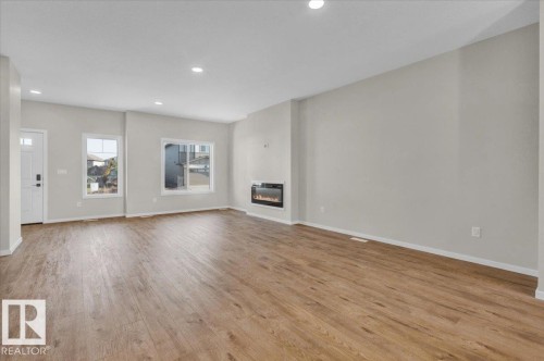 21 Ficus Way, Fort Saskatchewan, AB - Indoor Photo Showing Other Room With Fireplace