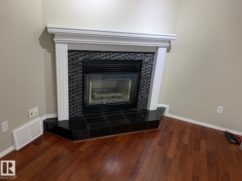 1535 80A Street, Edmonton, AB - Indoor Photo Showing Living Room With Fireplace