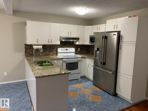 1535 80A Street, Edmonton, AB - Indoor Photo Showing Kitchen With Double Sink