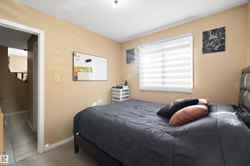Bedroom featuring a textured ceiling and carpet - 9804 156 Avenue, Edmonton, AB - Indoor Photo Showing Bedroom