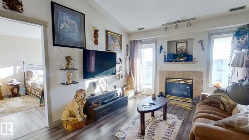 516 237 Youville Drive E, Edmonton, AB - Indoor Photo Showing Living Room With Fireplace