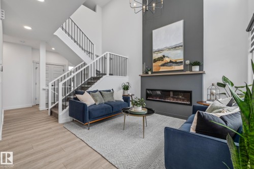 664 Astoria Way, Devon, AB - Indoor Photo Showing Living Room With Fireplace